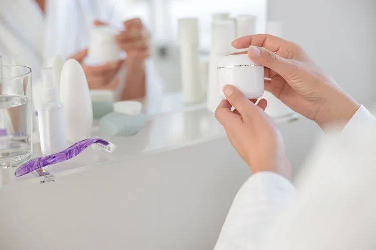 Woman applying cruelty-free face cream